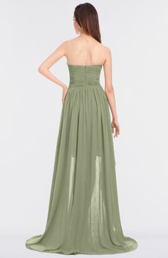 a woman in a long green dress