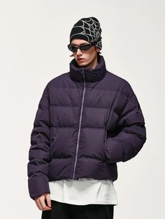 This versatile puffer jacket for men, designed with a unisex appeal, features a high neck and drop shoulders, perfect for a streetwear look. Its adjustable hem with elastic drawstrings and stopper tailors to your comfort, while the zip fastening and buttoned pockets add both style and functionality. Ideal for a cozy, c Long Sleeve Nylon Puffer Jacket For Streetwear, Urban Oversized Nylon Puffer Jacket, Winter Puffer Windbreaker For Streetwear, Urban Style Puffer Windbreaker For Fall, Winter Nylon Puffer Jacket For Streetwear, Urban Puffer Windbreaker For Fall, Urban Puffer Jacket For Streetwear, Solid Nylon Puffer Jacket For Streetwear, Trendy Nylon Outerwear For Streetwear