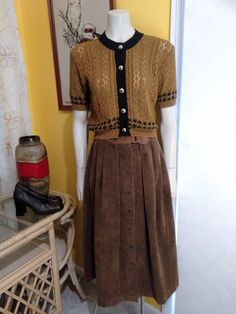 "The Iconic 'Sportscraft' Australian Brand founded in 1917. This skirt is in excellent condition, fastens with Brass D -Ring and 7 Press Studs in the front, features pleats around waist line and side pockets. It's a Vintage Size  10 or Modern AU6. Measurements: Waist 26\" Hips 38\" Waistband 1.75\" wide Brass D-Ring 1.25\"wide Side Pocket Opening 6.5\" Pocket Depth 5\" Length 33\"" Vintage Pleated Mini Skirt, Vintage Skirt For Fall, Vintage Pleated Bottoms For Fall, Embroidered Tee Shirt, Wide Wale Corduroy, Womens Skirts, Embroidered Tee, Beauty Case, Levis Denim