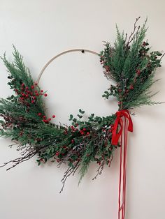 Artificial greenery, berries and branches on a gold hoop wreath. Multiple ways to hang the hoop as shown in photos. First picture is my favorite way to hang these hoop wreaths. Enjoy!     *measures approximately 29 inches Gold Hoop Wreath, Hoop Wreaths, Moss Wreath, Artificial Greenery, Flowers Arrangements, Holiday Wreath, Floral Wire, Wreath Ideas, Winter Wreath