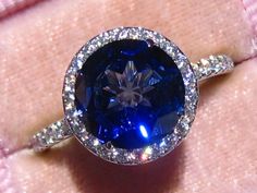 Moissanite Halo Engagement Ring With Jubilee Cut Lab Blue | Etsy Sapphire Jewelry With Halo Design And Round Cut, Sapphire Halo Design Jewelry With Round Cut, Dazzling Sapphire Jewelry With Halo Design, Moissanite Halo Ring With Gemstone, Timeless Sapphire Jewelry With Halo Setting, Timeless Sapphire Halo Jewelry, Dazzling Sapphire Ring With Halo Setting, Dazzling Sapphire Jewelry With Halo Setting, Round Cut Lab-created Sapphire Jewelry With Halo Setting