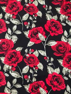 red roses on black background with silver leaves