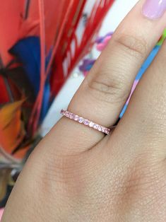 Pink Sapphire Eternity Ring 14K Rose Gold Pave Pink Sapphire | Etsy Rose Gold Cubic Zirconia Sapphire Ring With Prong Setting, Pink Sapphire Halo Ring Jewelry, Fine Jewelry Half Eternity Crystal Ring, Fine Jewelry Crystal Ring With Half Eternity, Stackable Pink Sapphire Wedding Ring, Pink Sapphire Stackable Ring For Wedding, Pink Diamond Eternity Band For Anniversary, Stackable Pink Sapphire Ring For Wedding, Pink Round Cut Eternity Band For Promise Ring