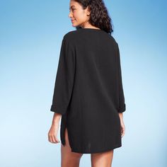 From enjoying a drink poolside to strolling the boardwalk, the Pullover Tunic Swimsuit Cover-Up from Kona Sol™ will make a perfect pick for all your needs. This long-sleeve swimsuit cover-up features a deep V-neckline to suit your style. Made with 100% cotton, this tunic-style cover-up helps provide breathable comfort all through your beach or pool fun. Kona Sol™: Made for your day in the sun. Relaxed Fit Long Sleeve Top For Beach Cover-up, Casual Black Poolside Cover-up, Long Sleeve Swimwear Upf 50+ For Summer, Relaxed Fit Long Sleeve Cover-up For Vacation, Long Sleeve Swimwear With Upf 50+ For Spring, Long Sleeve Upf 50+ Swimwear For Spring, Long Sleeve Tops For Pool And Spring, Long Sleeve Beachwear Swim Dress For Pool, Long Sleeve Swimwear With Upf 50+ For Summer