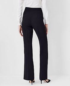 Elevate your wardrobe with the Ann Taylor Side Zip Trouser Pant, a masterpiece of design and comfort. These pants are meticulously tailored to flatter your figure, featuring a high-rise fit that sits just below the natural waist and a subtly flared leg that elegantly lengthens your silhouette.

- **Size**: Regular - 2
- **Color**: Black
- **Material**: 95% Polyester, 5% Spandex
- **Fit**: Tailored and fitted
- **Length**: Full length; 31 1/2" inseam with 20 3/4" leg opening
- **Closure**: Hidden Knitted Suit, Zip Dress, Trouser Pants Women, Trouser Style, Tall Women, Office Outfits, Trouser Pants, Evening Wear, Effortless Style