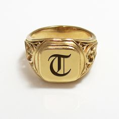 "The initial signet ring is a classic piece of jewelry for both men and women. Bring a little bling with this unique square-shaped initial signet ring in 24k gold plated brass with your choice of initial letters made especially for you. The monogram seal ring is polished to a high finish and decorated with a delicate ornamental design that will certainly be noticed as a refreshing element in any day or night outfit. This monogram ring is a perfect gift for a birthday, anniversary, as bridesmaid' 14k Gold Engraved Ring With Initials For Collectors, Classic Hallmarked Signet Ring For Collectors, Classic Hallmarked Signet Ring Collectible, Classic Gold Initial Ring Collectible, Personalized Yellow Gold Signet Ring Collectible, Elegant Signet Ring As Collectible, Collectible Yellow Gold Signet Ring With Initials, Classic Personalized Signet Ring For Collectors, Timeless Formal Signet Ring With Initials