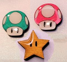 These adorable little Super Mario themed stud earrings are made with laser cut wood and mounted on Stainless Steel posts with push backings. They are painted using metallic and pearl acrylic paints, then sealed with a thick layer of epoxy to make these earrings shimmery and eye catching. They are approximately 1/2" tall as shown in photos. Mario Earrings, Make It Work, Butterfly Earrings, Laser Cut Wood, Pendant Set, Super Mario, Jewelry Earrings Studs, Mario, Etsy Earrings