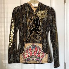 Christian Audigier Hooded Zip-Up Sweatshirt - Xs. Only Worn A Few Times. Great Condition. Lots And Lots Of Iconic Christian Audigier Details Throughout. Foil Graphics, Silky Gold Interior. Front Pocket Details. Panther On Front Is Felt. Gold Draw String On Hood. Zipper Has Ca Labeled Charm. See Photos. Fitted Graphic Print Hoodie Top, Fitted Graphic Print Hoodie, Fitted Graphic Print Hooded Sweatshirt, Fitted Hooded Graphic Hoodie, Fitted Hooded Hoodie With Graphic Print, Fitted Graphic Print Hoodie For Fall, Fitted Hoodie With Graphic Print For Fall, Sorel Caribou Boots, Crochet Romper