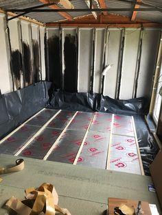 the inside of a house with insulation and flooring being laid on top of it