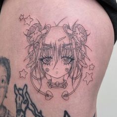 a woman's thigh with an anime tattoo on it