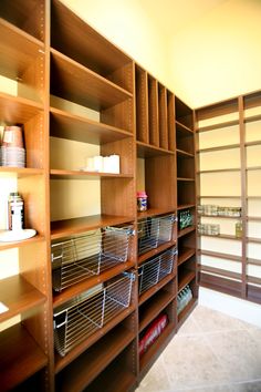 the shelves are filled with baskets and other items