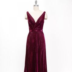 The Elegant Dress Made In The Silhouette Of The Sheath Will Emphasize Your Curves, While A Pleated Skirt Loose To The Bottom Will Allow You To Move Comfortably. The V-Neckline Will Complement The Image With Exquisite Jewelry And An Inconspicuous Zipper On The Back Will Ensure A Reliable Fixation Of The Dress. Length: Long Color: Burgundy Neckline: V-Neck Silhouette: Sheath Sleeve: Sleeveless Back: V-Back Skirt: Pleated Embellishments: Occasion: Romantic Date/Evening/Dinner, Wedding/Bridesmaid, G Red Pleated Dress For Gala, Sleeveless Burgundy Dress For Gala, Burgundy Sleeveless Gala Dress, Burgundy Sleeveless Dress For Gala, Burgundy Sleeveless Evening Dress, Burgundy Sleeveless Maxi Dress For Prom, Evening V-neck Dress With Pleated Waist, Burgundy Sleeveless Cocktail Dress, Elegant Pleated V-neck Evening Dress