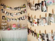 a table topped with pictures and photos next to a wall covered in magnets on clothes pins