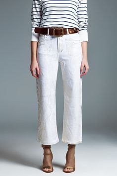 Step into a world of elegance and style with our White Wide Leg Jeans, designed to make a statement at any event. Premium Quality Fabric: Crafted from 100% Cotton, these jeans offer both comfort and durability. Model's Perfect Fit: Our model, standing tall at 5'9" with measurements of 33-25-36, wears a size S, providing a great reference for finding your ideal fit. Striking Gold Metallic Finish: The unique gold metallic finish across the jeans adds a luxurious and eye-catching touch, perfect for White Wide Leg Jeans, Model Standing, Tan Scarf, Types Of Jeans, Pants Fit, Style Party, Simple Tshirt, Denim Details, Sequin Top