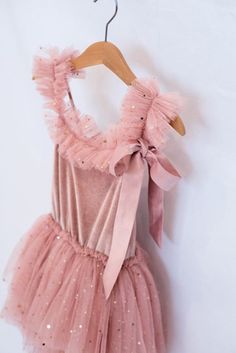 The Ballerina dress is simply magical and enchanting. The bodice is made from soft stretchy velvet and the tulle-layered skirt is soft beautiful tulle glittering with tiny little stars. There is an enchanting detail of ruffled tulle on the front of the adjustable straps and a long satin bow completes the pretty picture. Available in sizes  2-3, 4, 5, 6 and 8 2 colours ....pink and Vintage Blue Tulle Photoshoot, Ballerina Tutu Dress, Tulle Ruffle Dress, Tutu En Tulle, Tulle Tutu Dress, Rosé Sister, Flower Girl Dresses Tutu, Ballerina Dress, Tulle Tutu Skirt