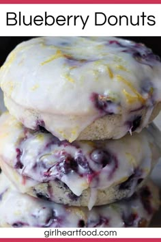 three blueberry donuts stacked on top of each other