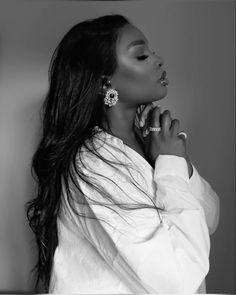 a black and white photo of a woman with long hair