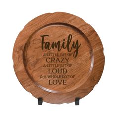 a personalized wooden plate with the words, family and sayings on it's side