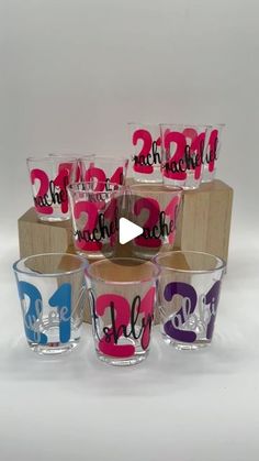 the glasses have numbers painted on them to spell out their names and date in different colors