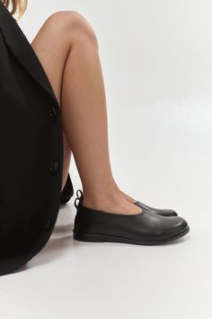 Veronika is a classic round-toe flat design with a modern feel. They are handcrafted from genuine black Italian leather with a wide and comfy toe box.  Memory insoles along the entire length of the shoe are soft and remember the foot's position. Tunit sole is a mixture of leather chips and rubber, it's more wear-resistant than leather and more durable. Also, we use soft natural upper materials that wear well and take the foot's shape. In the photos: Style: Veronika Heel: flat heel Material: black leather PERSONALIZATION: I can offer you a custom-made shoe design, based on existing models. You can request a desirable shape, form, or heel. Just write about what you wish and I will help. Feel free to choose the material and color. If you can't choose from the colors that we have, you can alwa Classic Black Ballet Flats With Rubber Sole, Black Flats With Stitched Sole, Classic Black Slip-on Ballet Flats, Elegant Black Ballet Flats With Textured Sole, Black Slip-on Ballet Flats With Textured Sole, Black Leather Slip-on Ballet Flats, Black Textured Slip-on Ballet Flats, Black Flats With Leather Sole And Plain Toe, Black Leather Ballet Flats With Textured Sole