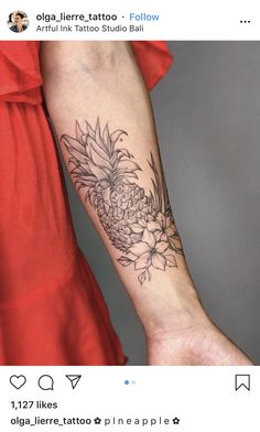 a pineapple tattoo on the left forearm and right arm is shown in black ink