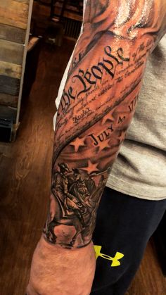 a man's arm with an american flag on it and the words, i love america