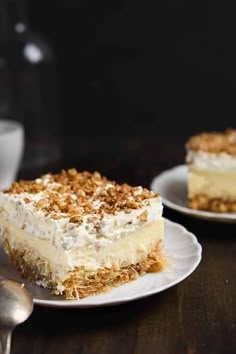 two plates with desserts on them and one has a slice missing from the cake