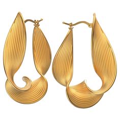 Discover our exclusive made-to-order Statement Twisted Hoop Earrings in 18k gold, meticulously handcrafted in Italy by Oltremare Gioielli. These unique, long twisted hoops feature a captivating ribbed surface and polished edges, embodying a perfect fusion of contemporary design and timeless sophistication. These Italian-made earrings are a true testament to individual style and craftsmanship, ensuring you stand out with every wear. 44 mm long beautiful hoop earrings crafted in polished and raw solid gold 18k or 14k Click top closure Gold hoop earrings made in Italy. The earrings are secured by a trusty snap closure. The approximate total weight is 14 grams in 18k Additional Information: The production time of this jewel varies from 3-4 working weeks. •Orders placed in the second half of Ju Modern Yellow Gold Earrings With Elegant Design, Modern Elegant Yellow Gold Earrings, Elegant Hoop Earrings With Polished Finish As Gift, Elegant Polished Finish Hoop Earrings As Gift, Elegant Hoop Earrings With Shiny Finish For Gift, Elegant Shiny Finish Hoop Earrings For Gift, Elegant Teardrop Hoop Earrings With Polished Finish, Luxury Teardrop Hoop Earrings With Polished Finish, Luxury Polished Teardrop Hoop Earrings