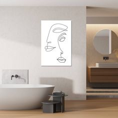 a bathroom with a bathtub, mirror and art work on the wall above it