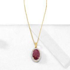 Ross-Simons - 6.30ct Ruby, .14ct t. w. Diamond Pendant Necklace in Gold. 16". Dress to impress. On a grand scale, this pendant necklace boasts a 6.30 carat oval ruby in a .14 ct. t. w. round brilliant-cut diamond halo. Suspends from a 14kt yellow gold rope chain with 2" extender and a lobster clasp. Diamond and ruby pendant necklace. Ruby birthstones are the perfect gift for July birthdays. Fine Jewelry Ruby Diamond Necklace Brilliant Cut, Dazzling Oval Necklace With Prong Setting, Oval Ruby Necklace With Brilliant Cut, Classic Ruby Necklaces For Formal Occasions, Gold Ruby Jewelry With Pave Setting, 14k Gold Oval Diamond Necklace With Gemstone, Formal Ruby Diamond Necklace With Brilliant Cut, Formal Pear-shaped Ruby Necklace, Classic Oval Necklace With Pave Setting