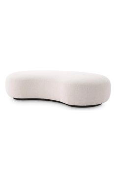 a white pillow sitting on top of a table