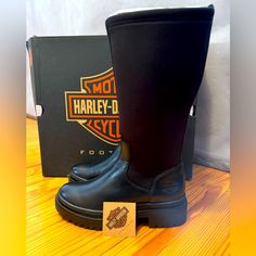 Harley-Davidson Women's Lenora 12-Inch Black Fashion Boots, Black-D84783. A Show Stopping Style That Is Ready For Anything, Measuring A Full 14-Inches From The Street To The Boot’s Collar. Greek For "Light", The Lenora Boot Boasts A Chunky, Yet Lightweight Outsole And Heel, Offering Both Style And The All-Day Comfort. The Shaft’s Stretch Fabric Allows For A Quick And Secure Fit While The Leather Provides Durability. Be Ready To Hit The Streets With Confidence! The Toe Is Smooth And Round, And Th Harley Davidson Boots For Women, Black Leather Fashion, Harley Davidson Shoes, Harley Davidson Boots, Shield Logo, Harley Davidson Women, Boots Black, Shoes Heels Boots, The Streets