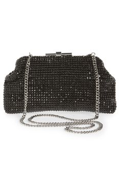 A beautiful way to shine up any look, this frame clutch is completely covered in shimmering crystals and finished with a removable chain strap. Magnetic frame closure Removable chain strap Interior wall pocket Lined Glass/textile Imported Chic Metal Evening Bag With Chain Strap, Chic Evening Bag With Bling For Night Out, Chic Sparkling Evening Bag For Events, Chain Clutch For Night Out, Clutch With Chain For Night Out, Chic Sparkling Clutch Evening Bag, Elegant Clutch With Chain For Night Out, Chain Clutch Evening Bag For Night Out, Glamorous Evening Bag With Chain Strap