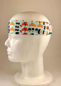 "100% cotton fabric with elastic back for a secure fit. Hand or machine wash cold for best results. Add your own buttons to secure a face mask or wear this to the gym, it's a great workout headband. Circular dimensions are 22\" and expand to 25\", width is about 2\". Handmade by a person with special needs. Our mission is to inpsire special needs individuals with the worldly skills of design, measuring, sewing, and tool working to create and sell one-of-a-kind upholstery and craft products. By p Casual Green Headband, Casual Sports Headband One Size Fits Most, Casual Sports Headband, One Size Fits Most, Adjustable Novelty White Headband, Casual Sports Headband, Casual Bandana Headband As Gift, Casual Bandana Styled As Headband For Gifts, Adjustable Casual Sports Bandana, Casual Sports Event Headband