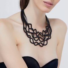 Curves Duo Necklace Black Curves Duo features 100% Argentine laser-cut leather in two strands. Because the leather is light and soft, the strands of the necklace play beautifully on bare skin or any fabric. 100% Argentine laser-cut leather construction. magnetic closure Approx. 19" Elegant Leather Necklace For Party, Luxury Double Strand Metal Necklace, Elegant Black Leather Necklaces, Elegant Black Leather Necklace, Symbolic Black Carved Necklace, Black Laser Cut Jewelry, Duo Necklace, Luxury Black Multi-strand Jewelry, Laser Cut Leather