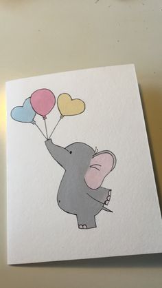 an elephant holding three heart shaped balloons on top of a white card with blue, yellow and pink hearts