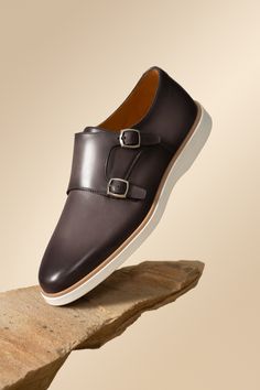 Modern Leather Monk Strap Shoes With Leather Sole, Slip-on Monk Strap Shoes With Rubber Sole, Designer Monk Strap Shoes With Buckle In Calf Leather, Luxury Slip-on Dress Shoes With Buckle Closure, Luxury Business Casual Monk Strap Shoes With Removable Insole, Luxury Leather Slip-on Shoes With Buckle, Modern Leather Monk Strap Shoes With Plain Toe, Fitted Leather Monk Strap Shoes With Buckle, Fitted Monk Strap Shoes With Buckle Closure