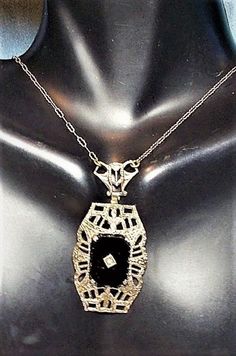 "REDUCED FROM $279.90. 1920s Edwardian Onyx Necklace w/ DIAMOND in Point Marked Sterling Filigree Etched FLORALOpen Work Art Deco Black 17\" Rhodium Paper Clip Necklace. The black onyx smooth clear & shiny (see the reflections on front & on back. Set in Edwardian Sterling marked on Pendant & clasp. Beautiful ornate antique Lavalier necklace only 16\", If you would like, I can add similar not identical paper clip chain for $8.00 an inch just email me. Other items in final pictures, I Victorian White Gold Necklaces For Evening, Victorian White Gold Necklace For Evening, Victorian Style White Gold Necklace For Evening, Antique Hallmarked Jewelry For Evening, Formal Art Deco Necklace With Polished Finish, Art Deco White Gold Necklace For Evening, Antique Evening Necklace With Intricate Design, Victorian Hallmarked Necklace For Evening, Victorian Evening Necklace With Hallmark