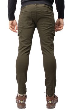 Solid chino pants constructed from comfortable stretch twill feature roomy cargo pockets for contemporary style. 13" leg opening; 9 3/4" front rise (size 32x32) Zip fly with button closure Five-pocket style Leg cargo pockets Skinny leg Stretch twill construction 64% cotton, 33% polyester, 3% spandex Machine wash, tumble dry Imported Model stats: 6'1" height, 32" waist. Model is wearing size 32x32. Khaki Stretch Cargo Pants, Khaki Fitted Cargo Pants, Khaki Cargo Pocket Chinos, Khaki Chinos With Cargo Pockets, Stretch Cargo Pants For Fall, Stretch Cargo Pants With Side Pockets For Fall, Stretch Fall Cargo Pants With Side Pockets, Fall Stretch Cargo Pants With Side Pockets, Stretch Khaki Cargo-style Bottoms