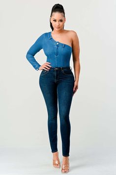 Introducing our Asymmetry Chic Denim Bodysuit, a sartorial masterpiece that celebrates the classic appeal of denim while embracing modern design elements. This bodysuit is a fashion-forward addition to any wardrobe, designed for the woman who appreciates bold statements and innovative style. Crafted from a soft, stretch-infused denim, this bodysuit offers a snug yet comfortable fit that contours the body, highlighting your silhouette with precision and flair. The striking feature of this piece is its unique one-shoulder design, which presents an asymmetrical neckline that captivates and intrigues. An additional flourish is the single long sleeve, which balances the off-shoulder cut, creating an alluring contrast that is both sophisticated and seductive. A classic blue wash brings an air of Modern Design Elements, Denim Bodysuit, Bold Statements, Denim Chic, Asymmetrical Neckline, Innovative Fashion, Shoulder Cut, Jumpsuit Fashion, Shoulder Design