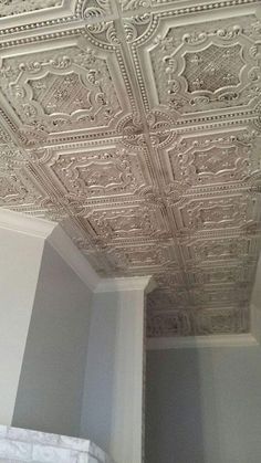 the ceiling in this room is made out of tin foil and has intricate designs on it