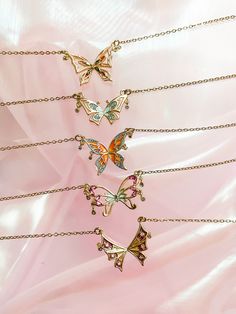 "🦋 Inspired by Season 3 of the animated show Winx, grab these necklaces to wear and flaunt your inner fairy! Chain length is 16\" to 18\" (extendable)! ⭐️ comes with a jewelry box/case, polishing cloth* * based on supply availability ‼️ If you would like to receive individual boxes for each necklace, please mark them as gifts! If an order with more than one necklace is not marked as a gift, it will be packaged with only one box." Fairycore Gold Necklaces For Party, Fairycore Gold Party Necklaces, Fairycore Jewelry With Butterfly Charm For Gifts, Whimsical Pendant Necklaces For Party, Whimsical Necklaces For Gifts, Fairycore Butterfly Necklace As A Gift, Fairycore Butterfly Necklace For Gift, Whimsical Pendant Necklace For Party, Fairycore Butterfly Necklace Gift