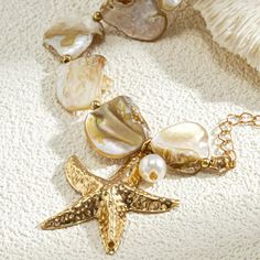 Boho Exquisite Gold Starfish Charm Bracelet - Summer Beach Fashion Jewelry for Women Elevate your summer style with the Boho Exquisite Gold Starfish Charm Bracelet. This elegant piece features a charming gold starfish pendant, embodying the essence of beach fashion and boho chic. Crafted with attention to detail, this bracelet combines classic elegance with a playful summer vibe. Its gold color adds a touch of sophistication, while the starfish charm evokes a sense of coastal adventure. Perfect Bohemian Beach Bracelets With Starfish Charm, Bohemian Style Bracelet With Starfish Charm, Bohemian Gold Starfish Charm Jewelry, Adjustable Gold Charm Bracelet With Starfish Charm, Summer Beach Fashion, Ocean-inspired Starfish Charm Bracelet For Beach, Festival Chic, Bracelet Summer, Summer Fashion Beach