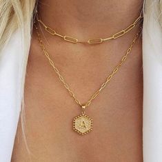 Show off your personalized style with this lovely Paperclip Hexagon Monogram Layer Necklace. This piece is a cool twist on the monogram trend, allowing you to flaunt your initials in an edgy yet chic way. Crafted from stainless steel and dipped in 18 karat gold, this necklace isn't just about looks - it's built to last. The hexagonal pendant adds a geometric touch, while the paperclip chains add a dash of fun to your ensemble. And with the entire alphabet available, you can make this piece uniqu Initial Necklace Layering, Paperclip Necklace Layering, Trendy Everyday Monogram Jewelry, Trendy Paperclip Chain Jewelry With Initial Pendant, Trendy Jewelry With Paperclip Chain And Initial Pendant, Trendy Initial Pendant Paperclip Chain Jewelry, Trendy Initial Pendant Paperclip Chain, 18k Gold Necklace, Layered Necklace Set