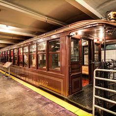 an old train car is parked in the station