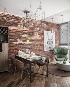 a dining room with brick wall and wooden flooring is shown in this modern apartment