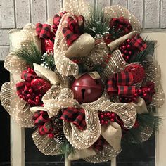 a christmas wreath hanging on the front door