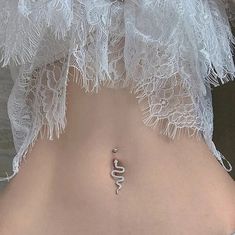 the back of a woman's stomach with an arrow tattoo on it