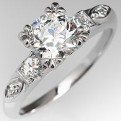 The vintage ring is centered with one (1) old European cut diamond weighing 1.00 carat and set into a four-split-prong head. The shoulders of the ring are each accented with one (1), prong set, round transitional brilliant cut diamond and one (1), bead set, round single cut diamond. The ring measures 6.7mm at the top, rises 6.2mm above the finger, tapering to 1.6mm wide and 1.3mm thick at the base of the shank. This ring is currently a size 6 and we offer complimentary resizing to fit. Crown Engagement Ring, Montana Sapphire Engagement, Montana Sapphire Engagement Ring, Sapphire Engagement Rings, Rings Antique, Antique Diamond Rings, Vintage Engagement Ring, Diamond Engagement Rings Vintage, Engagement Ring White Gold