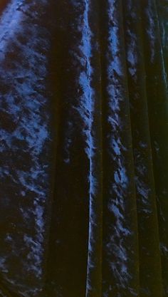 a close up of a blue velvet material